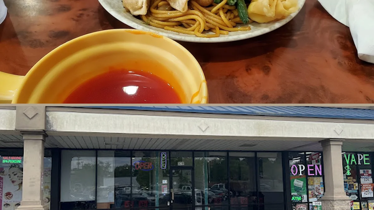 Buffet counter with trays of Chinese dishes